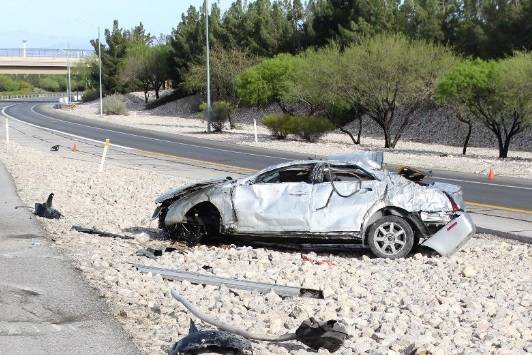 The scene of a fatal car crash on Summerlin Parkway near Anasazi Drive in Las Vegas, Thursday, ...