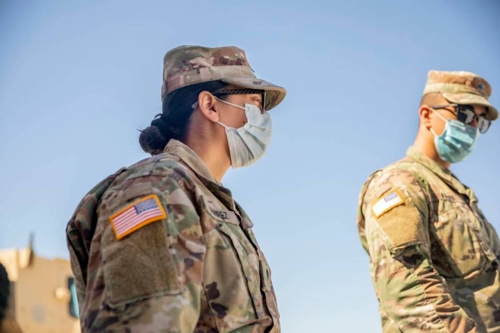 Spc. Iris Ramirez, left, and Spc. Karim Arafa discuss the mission of delivering personal protec ...