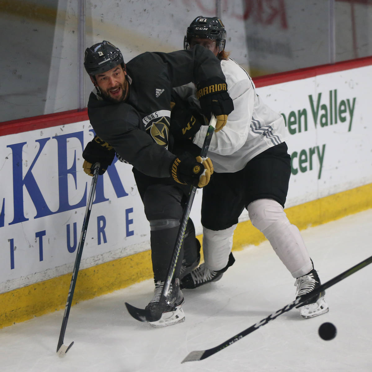 Vegas Golden Knights defenseman Deryk Engelland (5) clears the puck under pressure from center ...