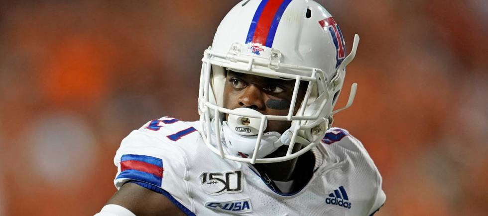 Louisiana Tech's Amik Robertson (21) signals against Texas during the second half of an NCAA co ...