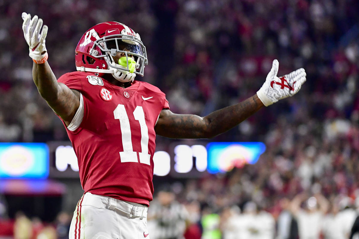 Alabama wide receiver Henry Ruggs III (11) salutes the fans against LSU during the second half ...