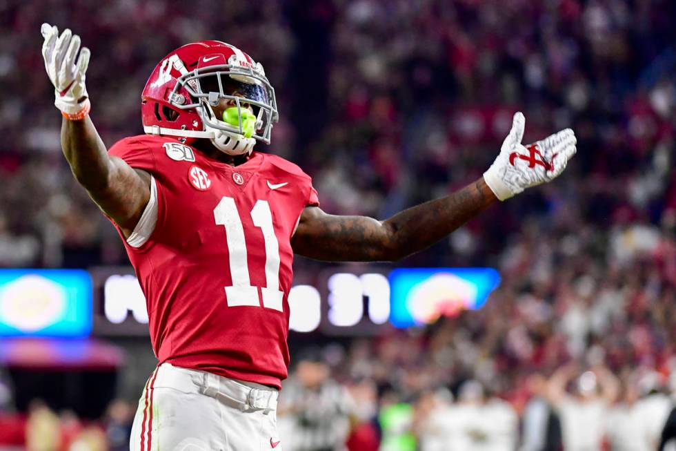 Alabama wide receiver Henry Ruggs III (11) salutes the fans against LSU during the second half ...