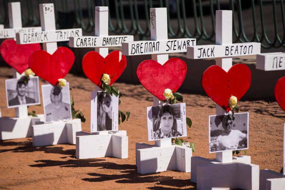 Some of the 58 crosses near the "Welcome to Fabulous Las Vegas" sign placed by Greg Z ...