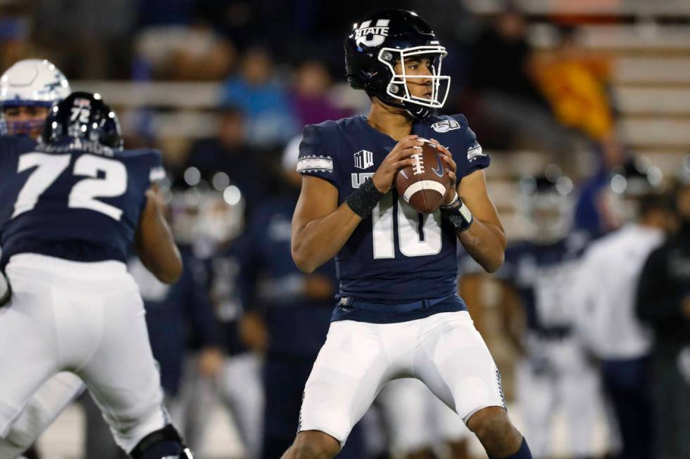 FILE - In this Oct. 26, 2019, file photo, Utah State quarterback Jordan Love looks for a receiv ...