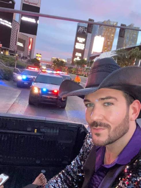 Las Vegas country artist Chase Brown takes a selfie with Metro units in the background on the S ...