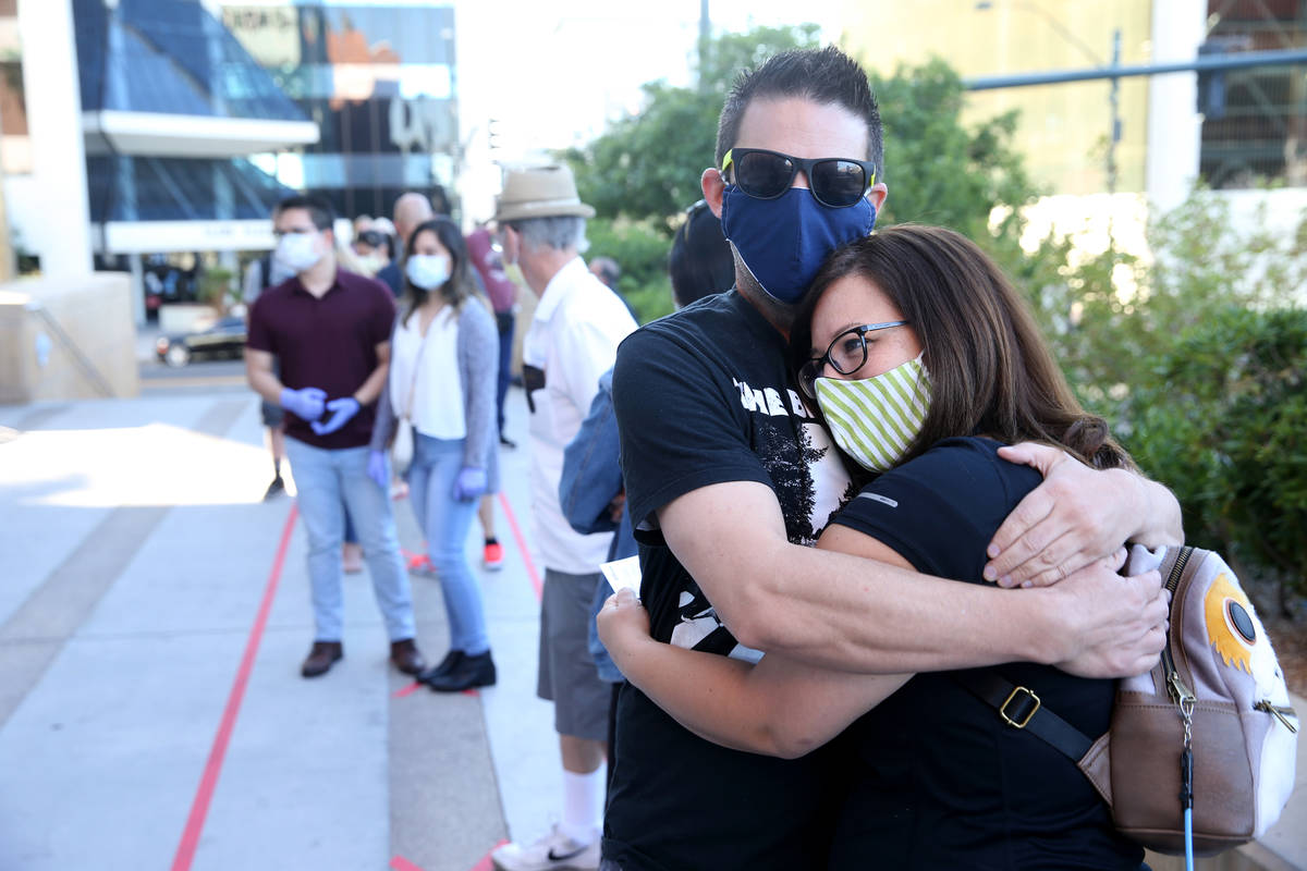 Couples, including first-in-line Jenny Paez and George Wells of Las Vegas, right, wait for for ...