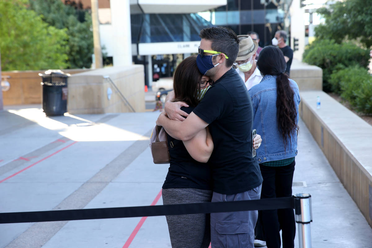 Couples including first-in-line Jenny Paez and George Wells of Las Vegas, right, wait for for t ...