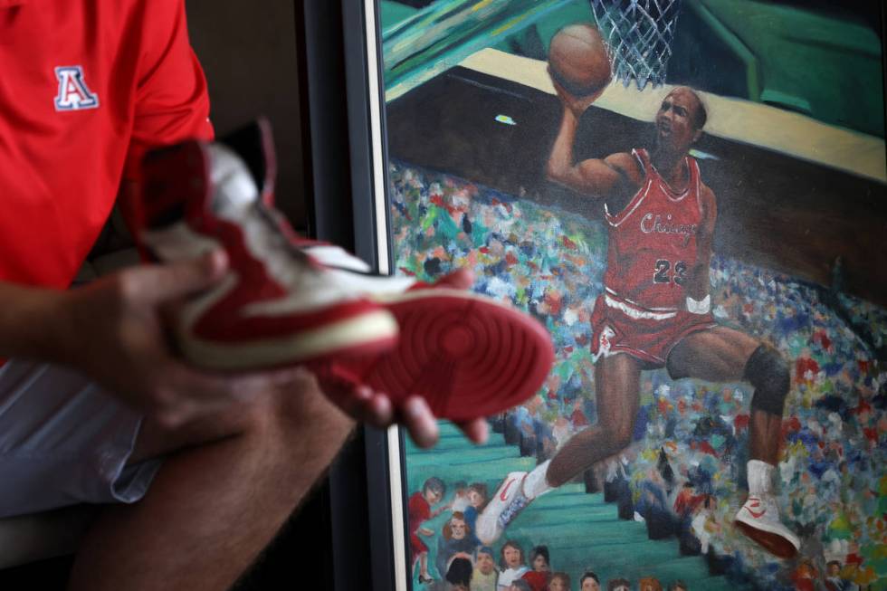 Trent Othick shows a paining of Michael Jordan painting inside his Las Vegas home, Tuesday, Apr ...