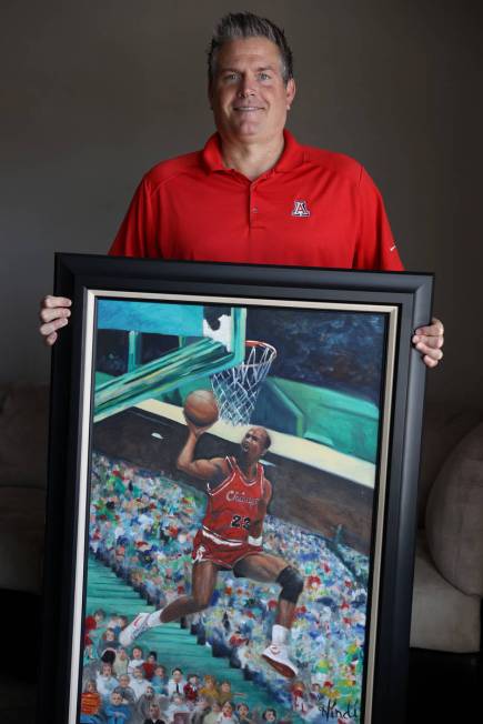 Trent Othick shows a paining of Michael Jordan painting inside his Las Vegas home, Tuesday, Apr ...