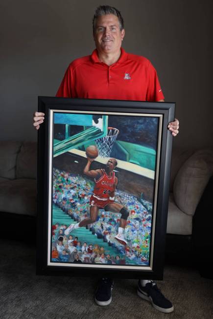 Trent Othick shows a paining of Michael Jordan painting inside his Las Vegas home, Tuesday, Apr ...