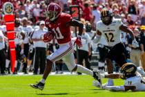 In this Sept. 21, 2019, file photo, Alabama wide receiver Henry Ruggs (11) runs in for a touchd ...