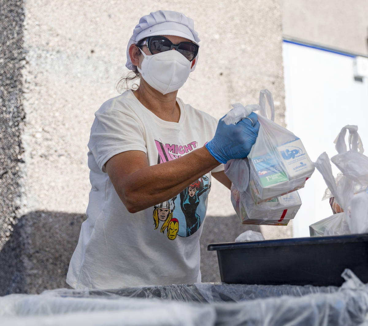 Food service manager of Basic Academy of International Studies, Yanina Cartellone, sorts meals ...