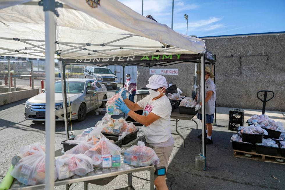 Food service manager of Basic Academy of International Studies, Yanina Cartellone, sorts meals ...