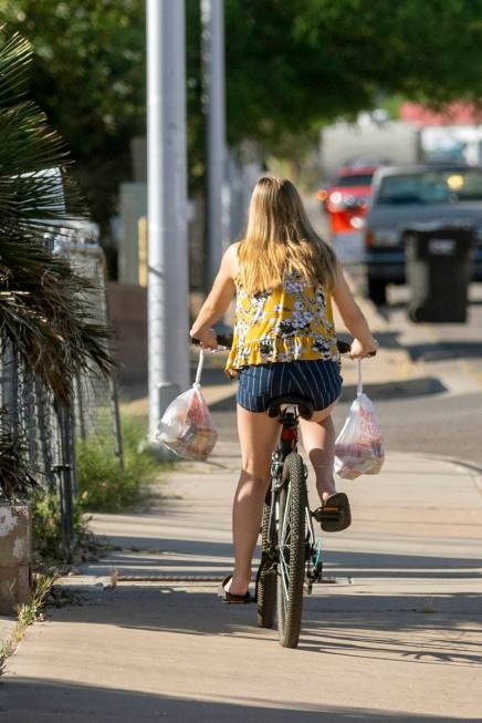 Emily Hartung, 18, senior of Basic Academy of International Studies, leaves the CCSD food distr ...