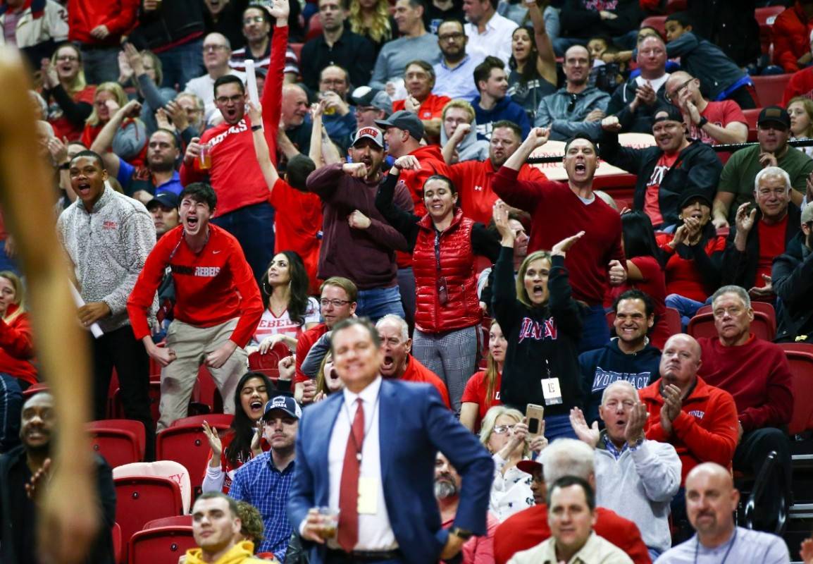 UNLV fans celebrate during the second half of a basketball game against UNR at the Thomas & ...