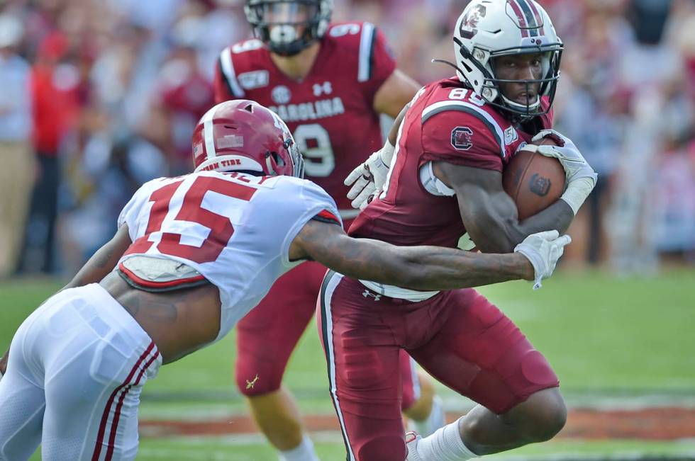 South Carolina's Bryan Edwards (89) rushes while defended by Alabama's Xavier McKinney during t ...