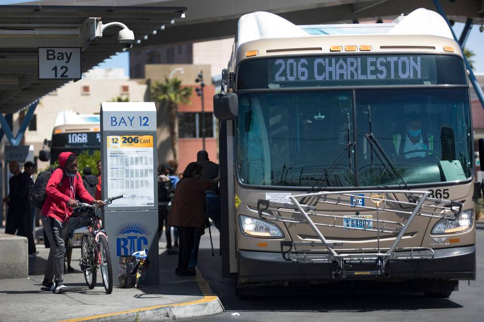 Passengers get off and on the bus at the Bonneville Transit Center in Las Vegas, Tuesday, April ...