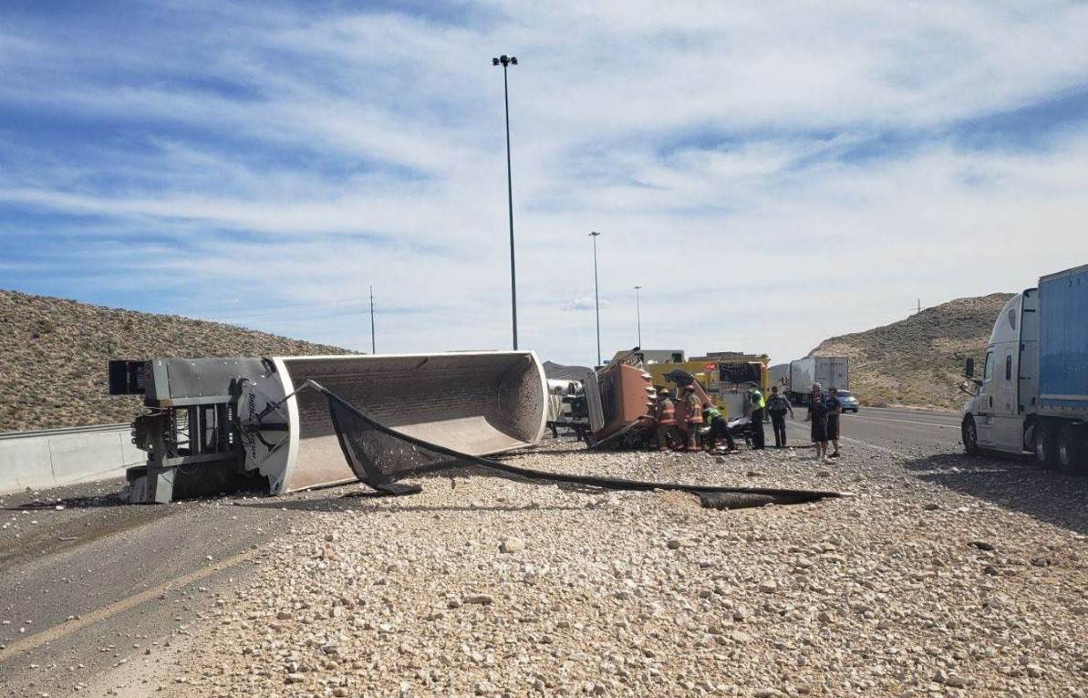 Troopers investigate a gravel truck rollover Wednesday, April 29, 2020, on southbound Interstat ...