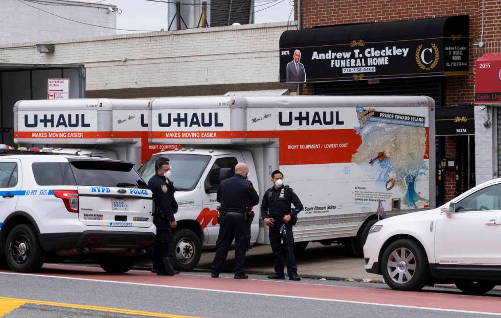 New York City police officers stand by at the Andrew T. Cleckley Funeral Home in the Brooklyn b ...