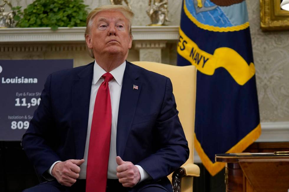 President Donald Trump attends a meeting about the coronavirus with Louisiana Gov. John Bel Edw ...