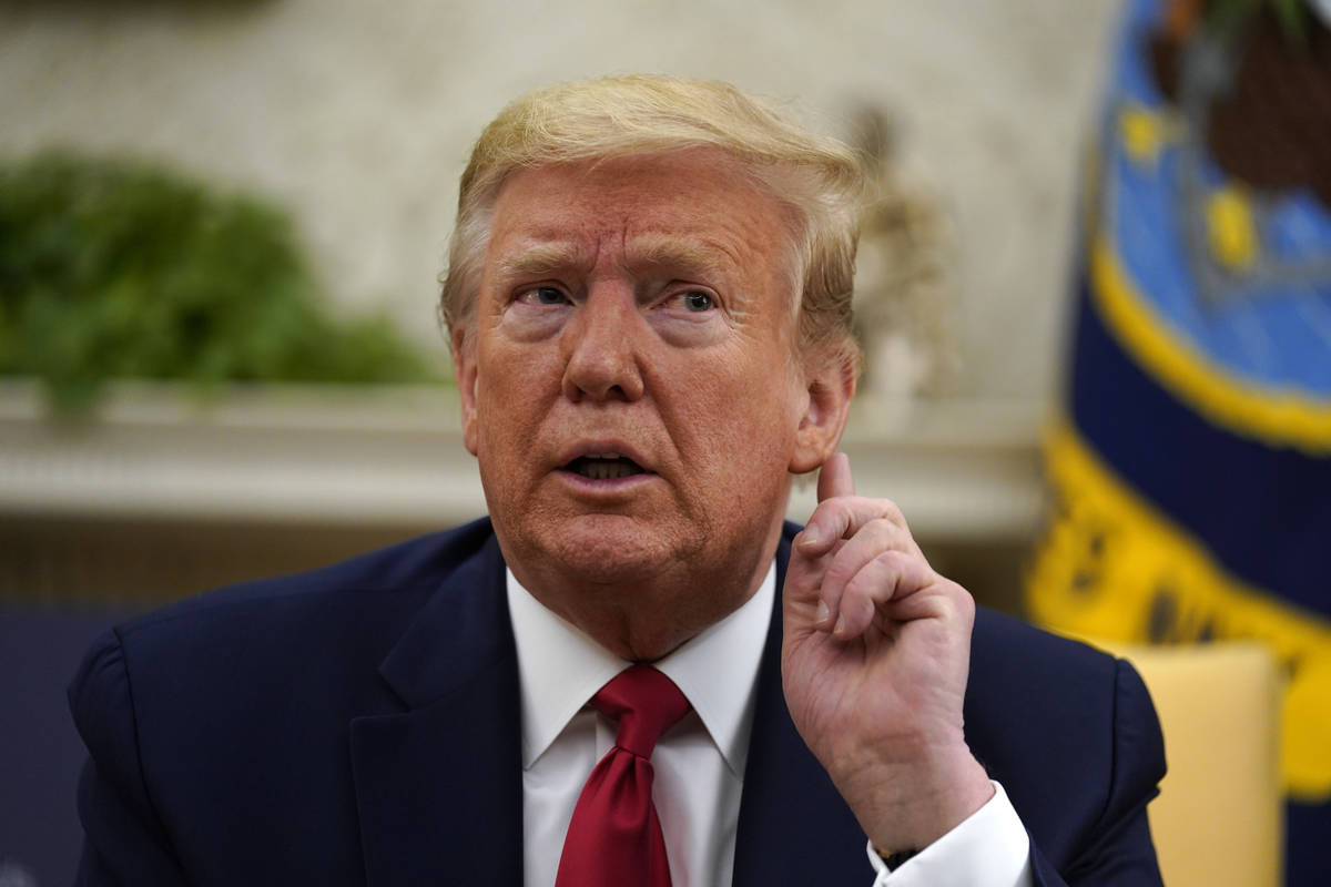 President Donald Trump listens during a meeting about the coronavirus with Gov. John Bel Edward ...