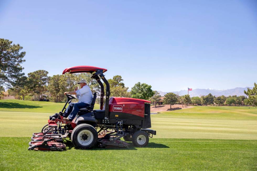 Groundskeeping is done to prepare for the opening of the Spanish Trail Country Club and Golf Co ...