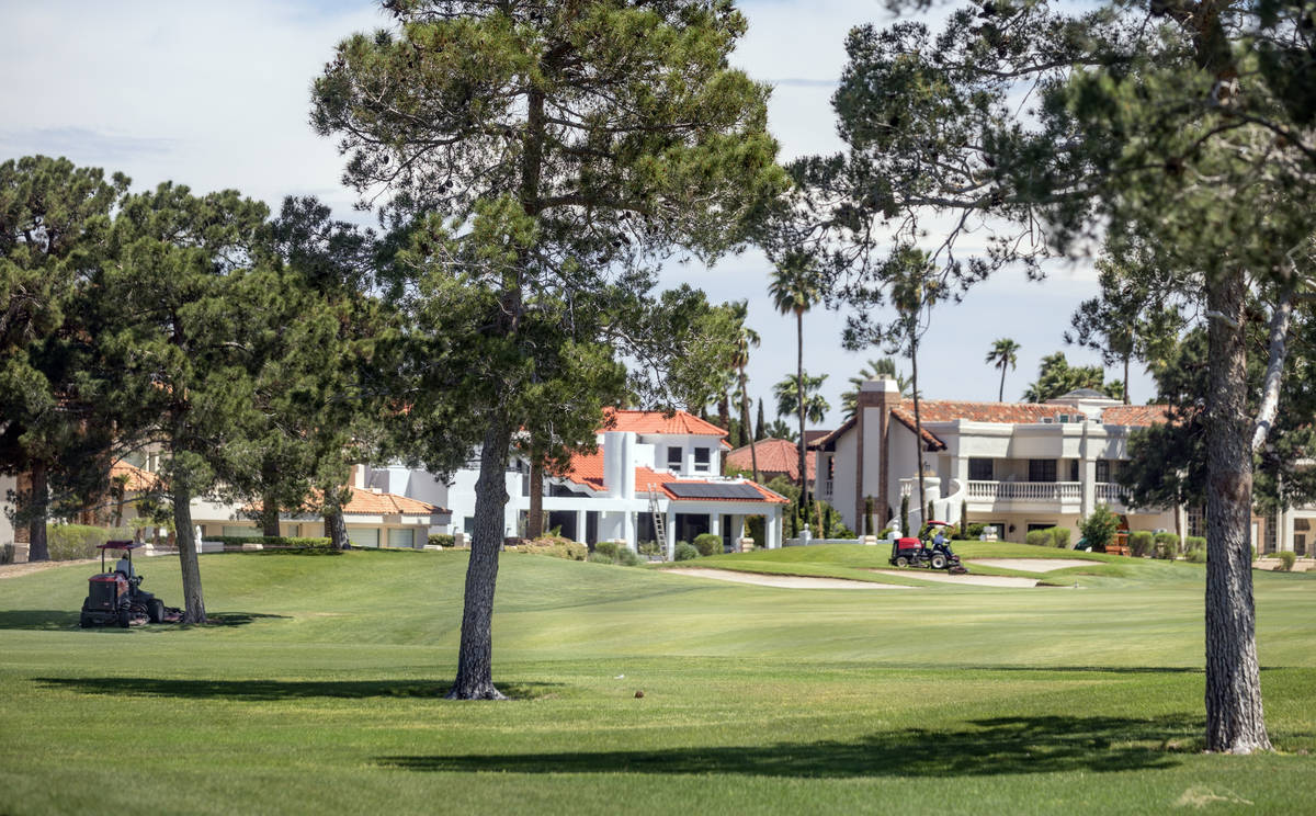 Groundskeepers prepare for the opening of the Spanish Trail Country Club and Golf Course in Las ...