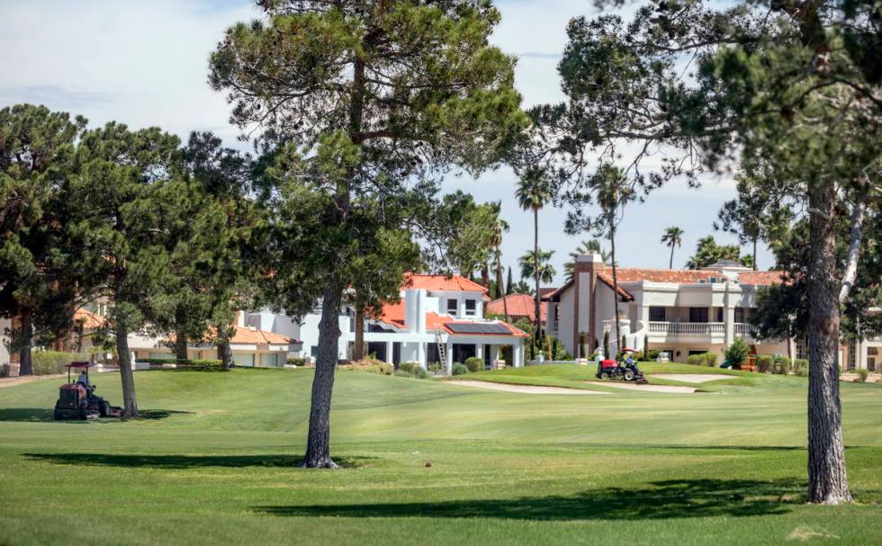 Groundskeepers prepare for the opening of the Spanish Trail Country Club and Golf Course in Las ...