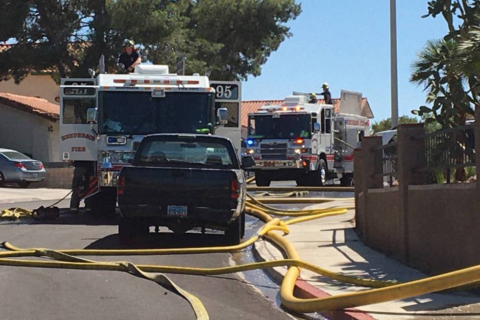 Crews battle a fire Thursday, April 30, 2020, on the 300 block of Esquina Drive in Henderson. ( ...