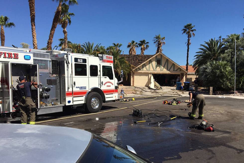 Crews battle a fire Thursday, April 30, 2020, on the 300 block of Fuente Drive in Henderson. (M ...