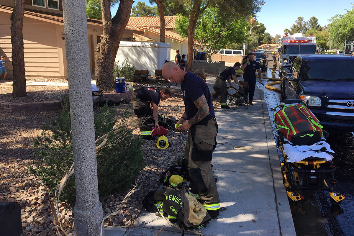 Crews battle a fire Thursday, April 30, 2020, on the 300 block of Fuente Drive in Henderson. (M ...