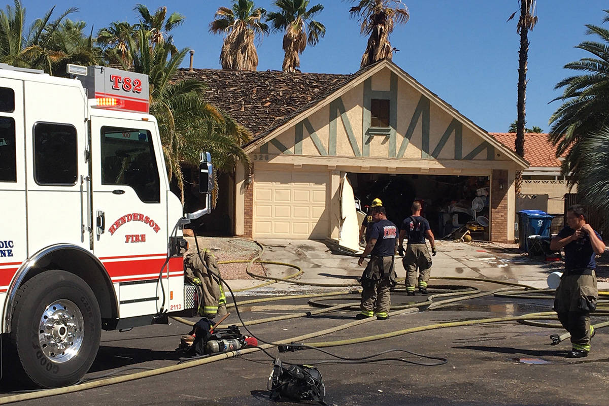 Crews battle a fire Thursday, April 30, 2020, on Fuente Drive in Henderson. (Michael Quine/Las ...