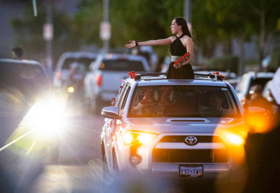 Desert Oasis High School students participate in a senior prom parade in Las Vegas on Friday, M ...