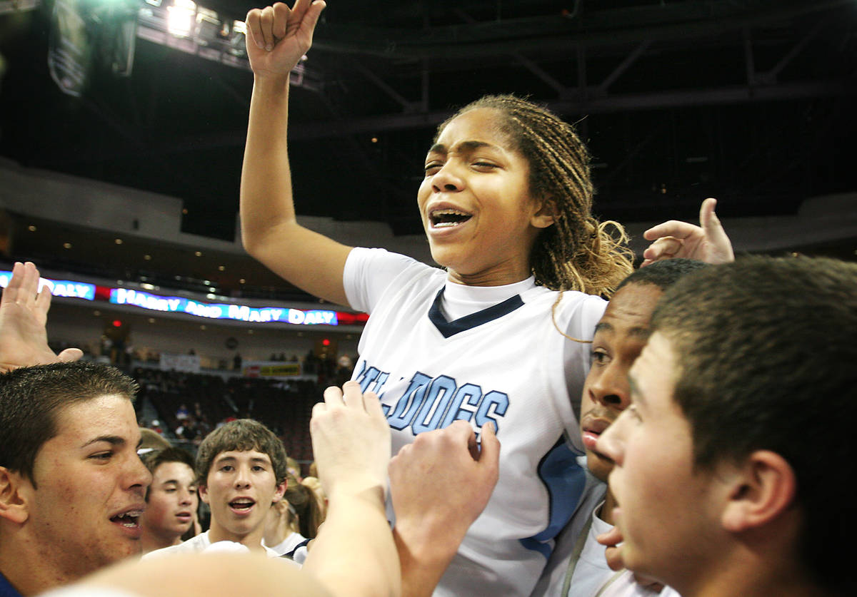 Centennial's Alexis Byrd celebrates on center court moments after hitting both her free throws ...