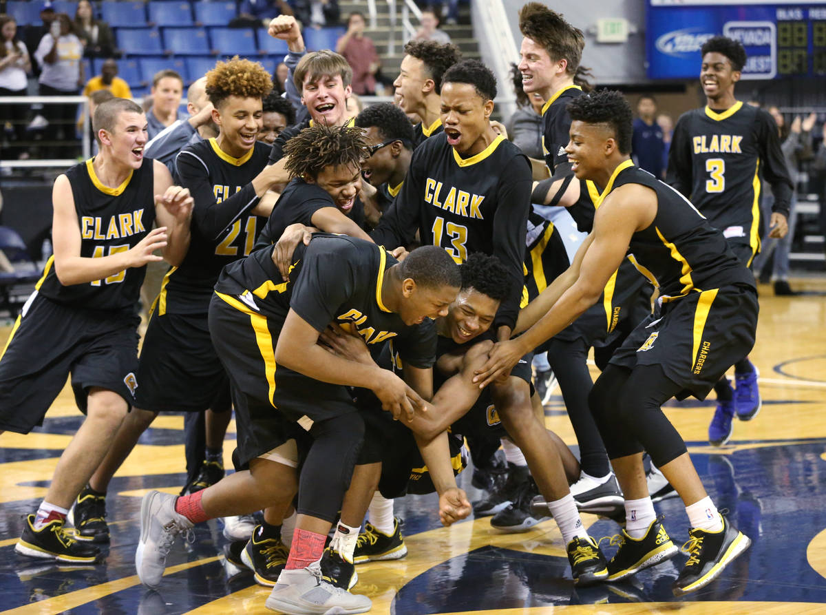 Clark celebrates its 43-39 over Desert Pines in the NIAA Division I-A state basketball champion ...