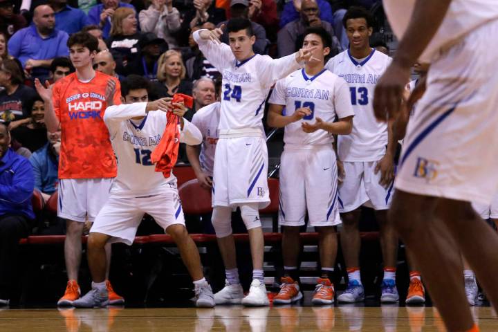 Bishop Gorman players react after one their teammates scores against Clark during the second ha ...