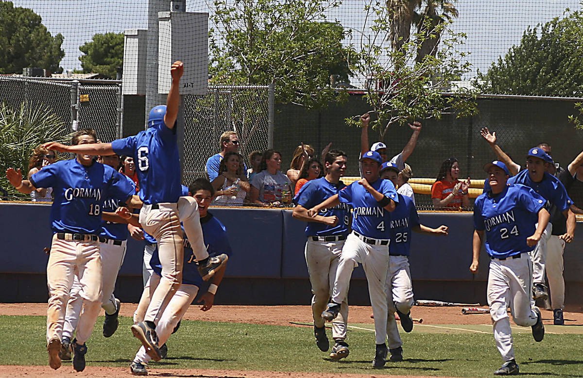 Bishop Gorman baseball players celebrate their victory over Galena High School in the State Ch ...