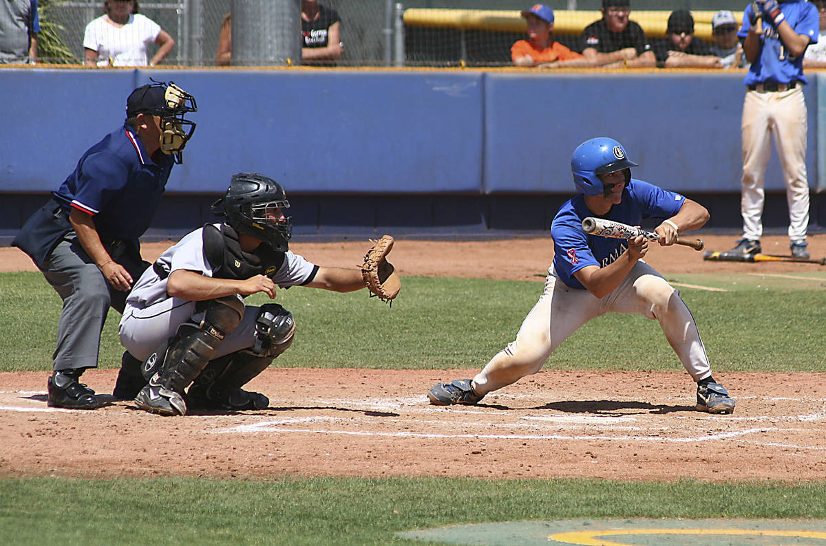 Bishop Gorman catcher John Rickard tries to lay down a bunt during the state championshipgame w ...
