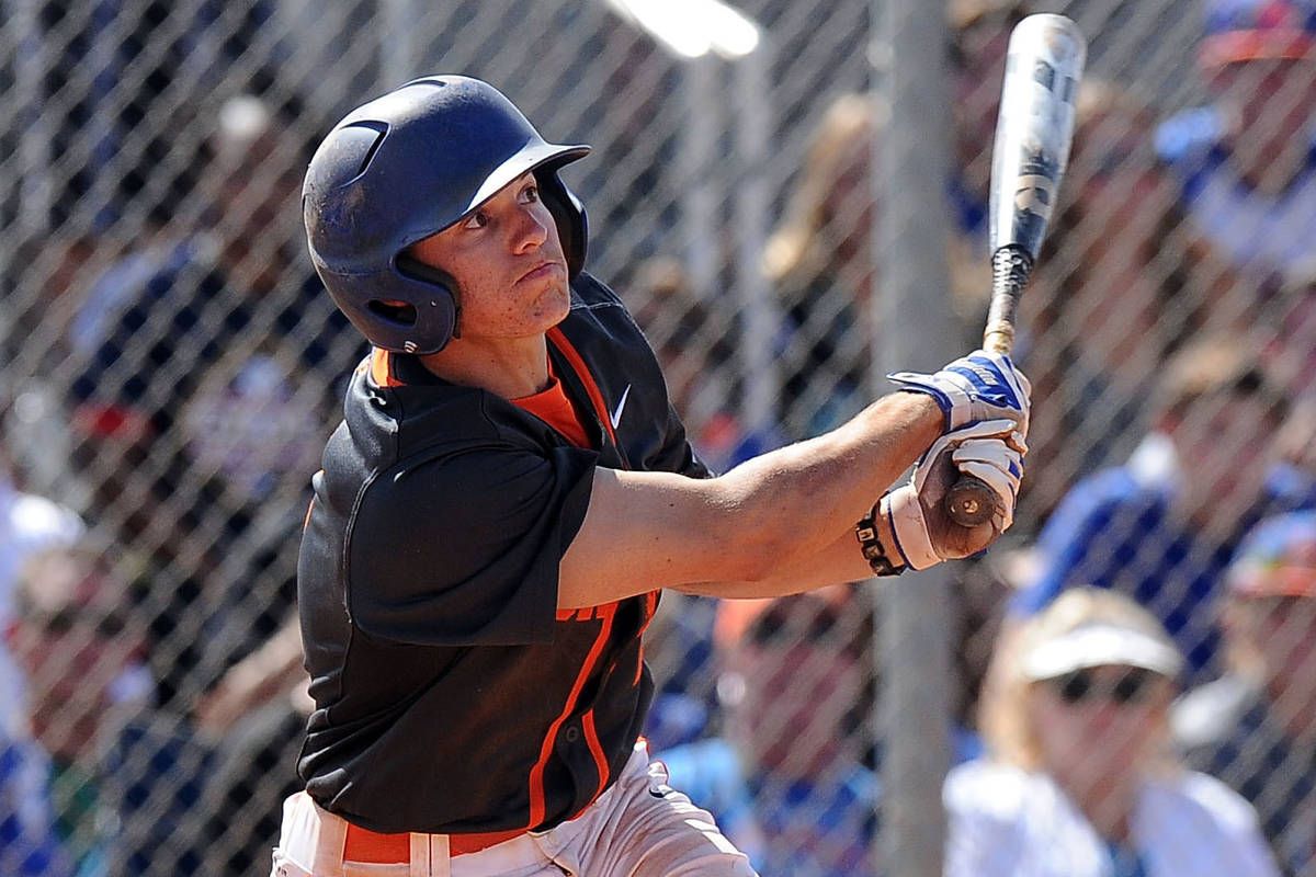 Bishop Gorman shortstop Cadyn Grenier (2) hits a walk-off home run against Green Valley in the ...