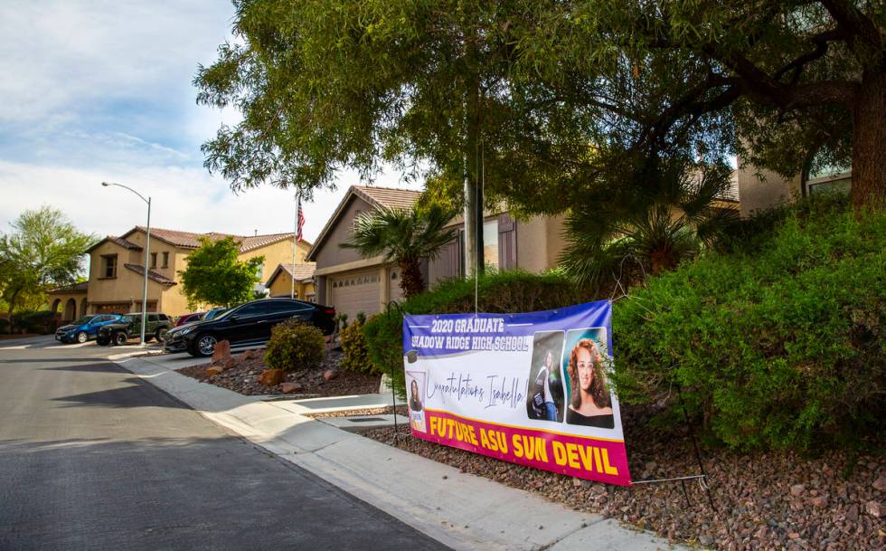 A sign outside the home of Isabella Rowles, a senior graduating from Shadow Ridge High School, ...