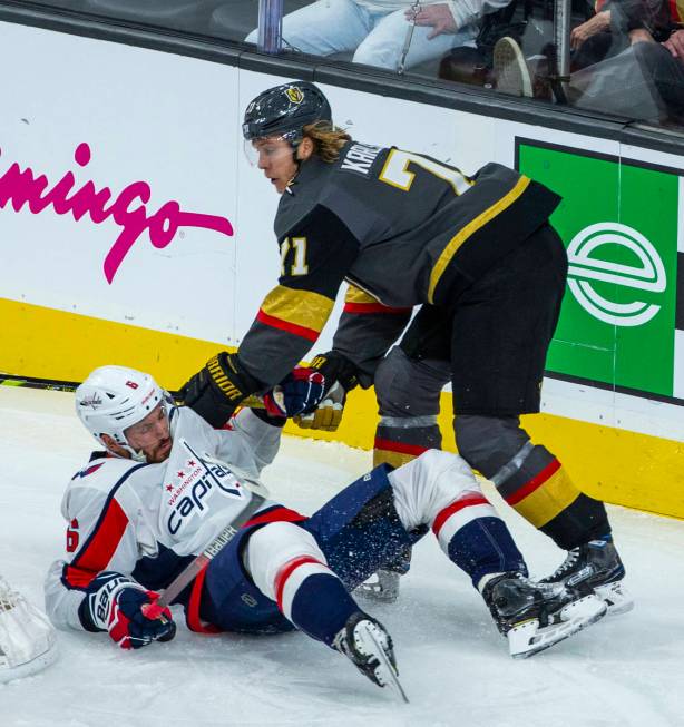 Vegas Golden Knights center William Karlsson (71, right) knocks Washington Capitals defenseman ...