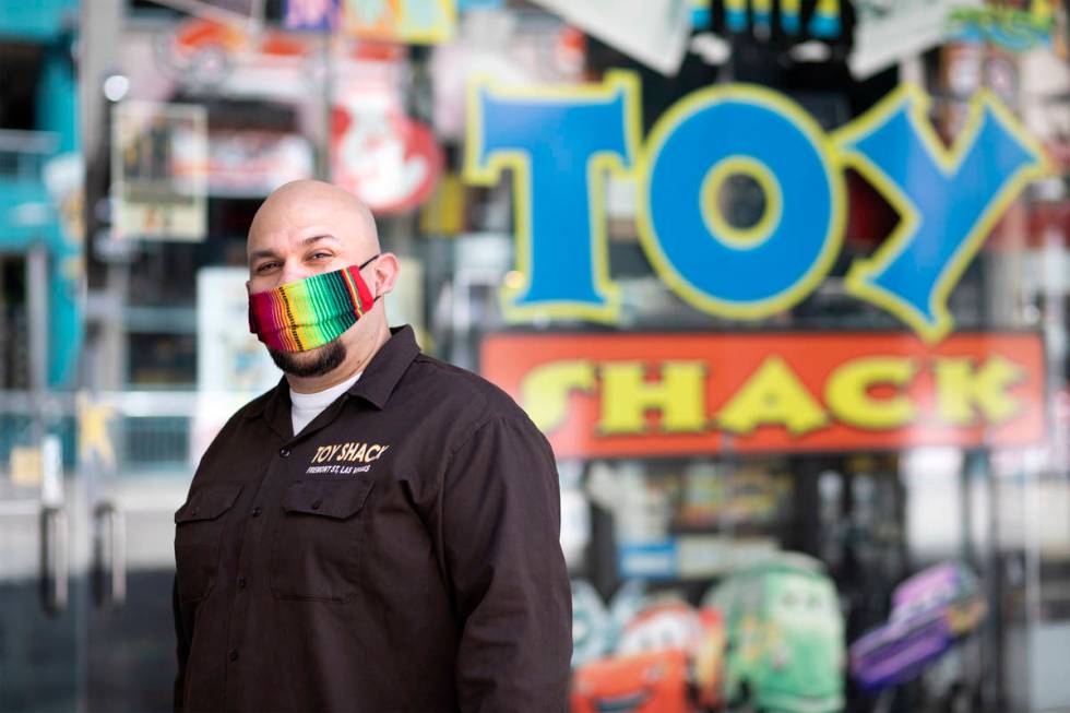 Johnny Jimenez Jr., owner of Toy Shack, stands for a portrait next to his store in the Neonopol ...