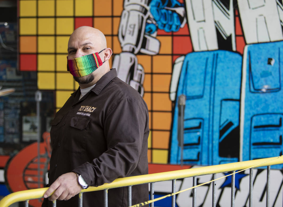 Johnny Jimenez Jr., owner of Toy Shack, stands for a portrait next to his store in the Neonopol ...