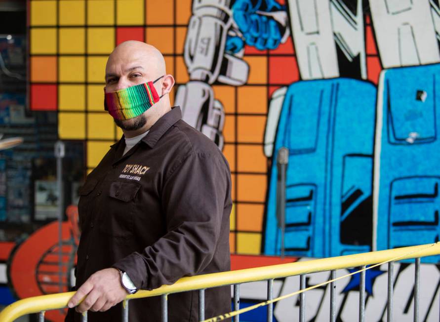 Johnny Jimenez Jr., owner of Toy Shack, stands for a portrait next to his store in the Neonopol ...