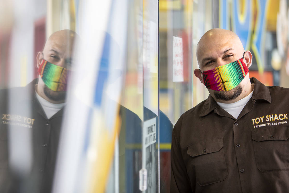 Johnny Jimenez Jr., owner of Toy Shack, stands for a portrait next to his store in the Neonopol ...