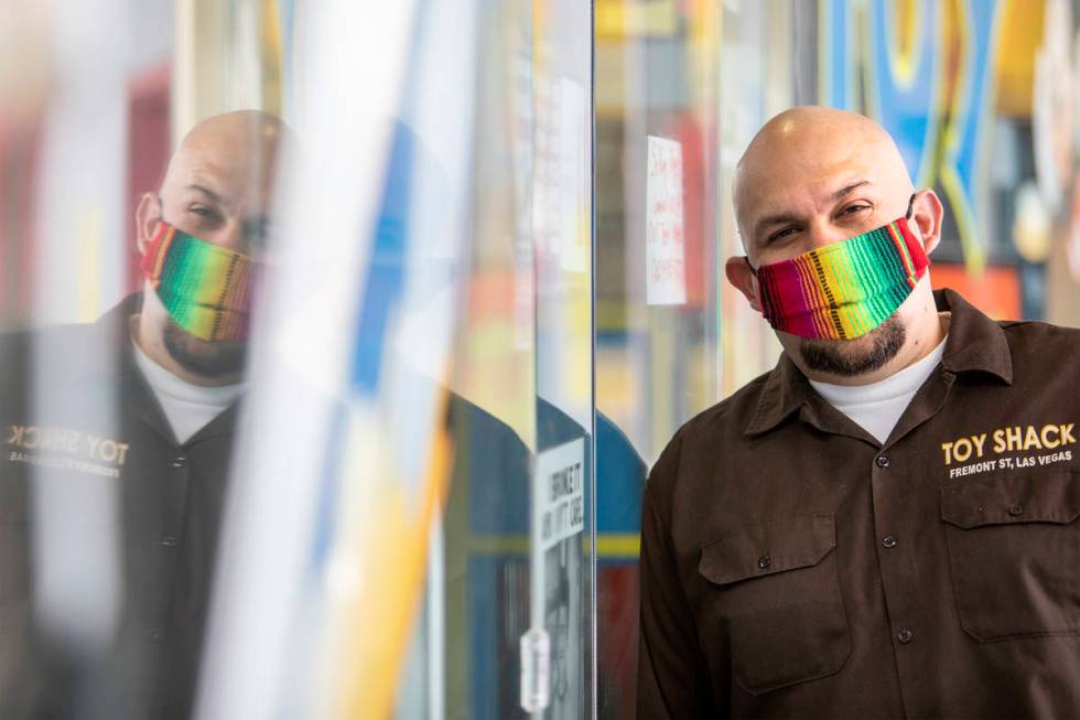 Johnny Jimenez Jr., owner of Toy Shack, stands for a portrait next to his store in the Neonopol ...