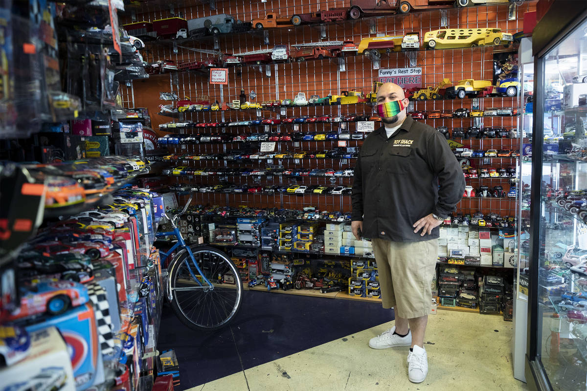 Johnny Jimenez Jr., owner of Toy Shack, stands for a portrait in his store in the Neonopolis sh ...