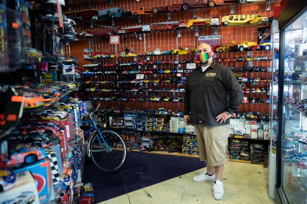 Johnny Jimenez Jr., owner of Toy Shack, stands for a portrait in his store in the Neonopolis sh ...