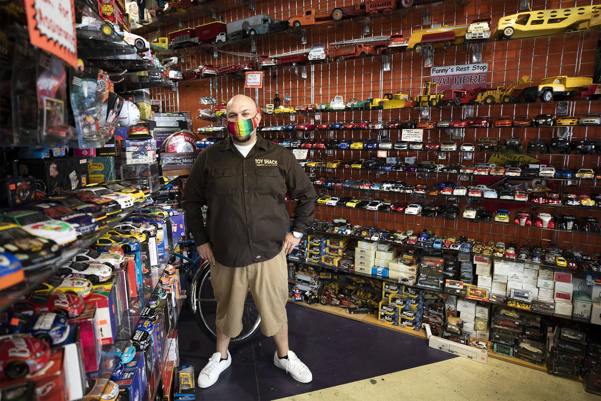 Johnny Jimenez Jr., owner of Toy Shack, stands for a portrait in his store in the Neonopolis sh ...