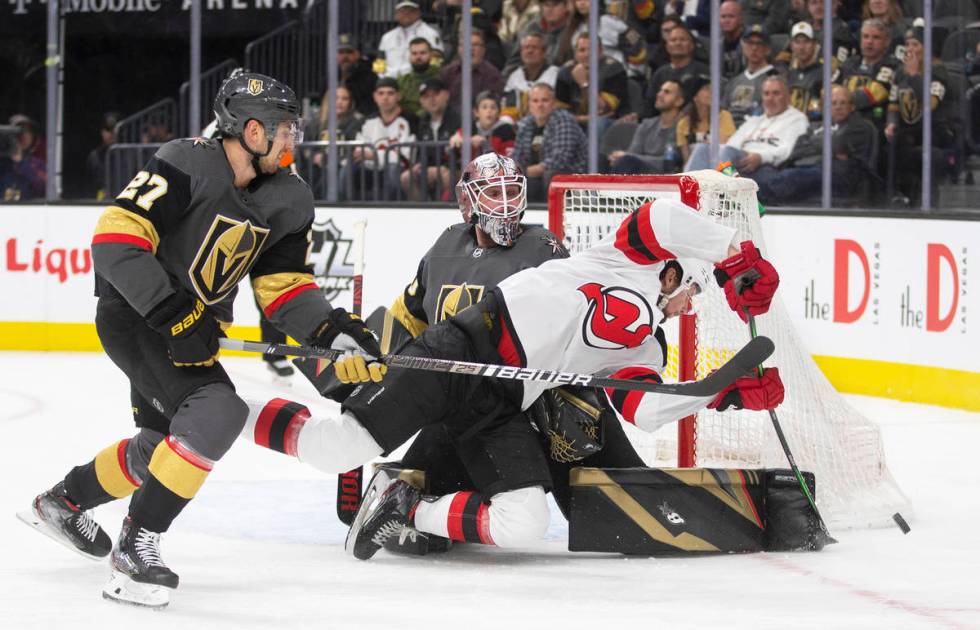 Vegas Golden Knights goaltender Robin Lehner (90) makes a save against New Jersey Devils left w ...